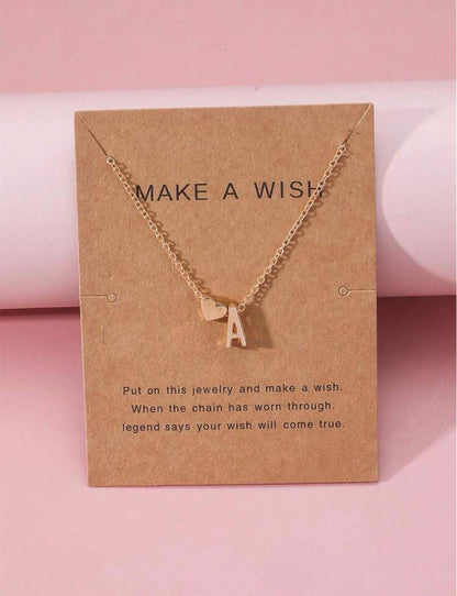 Make a Wish Initial Necklace - Gold with heart charm on kraft card