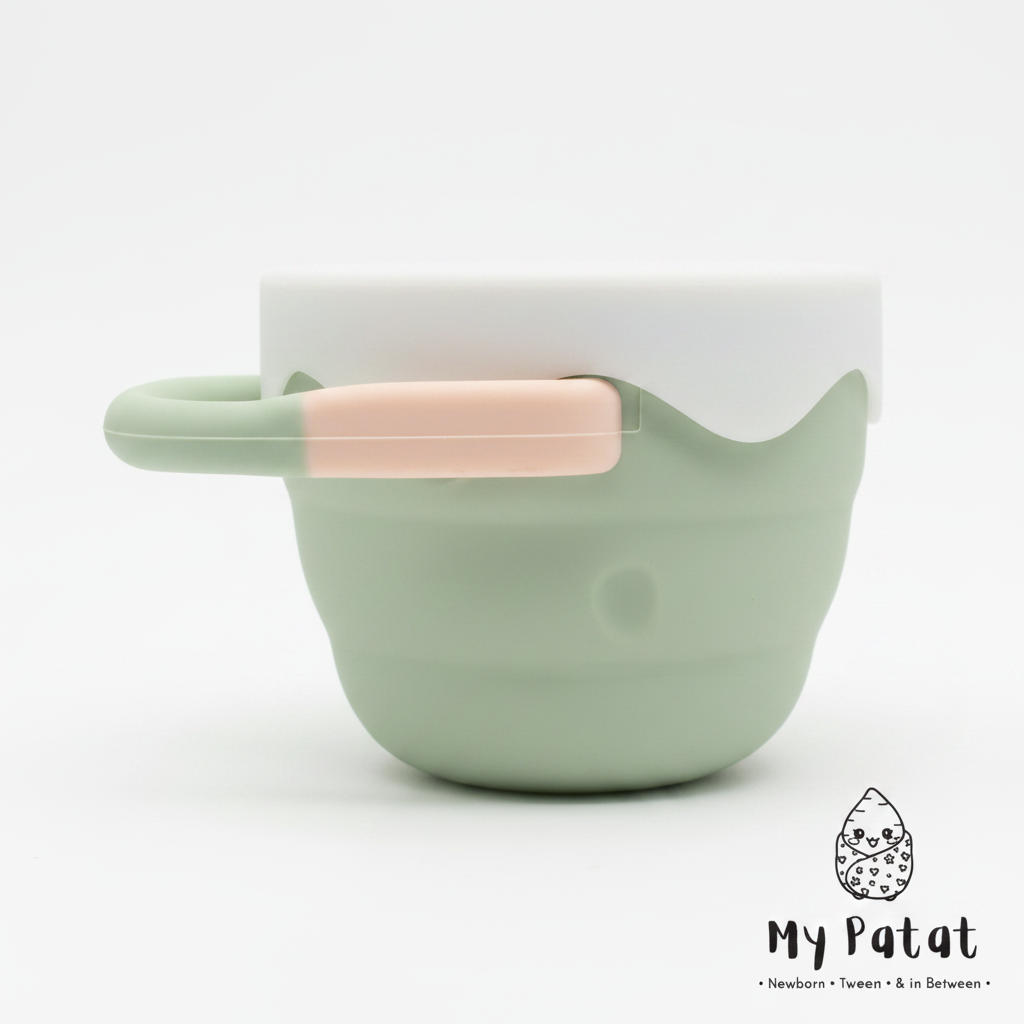 Sage green silicone snack cup with white lid