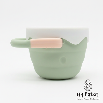 Sage green silicone snack cup with white lid