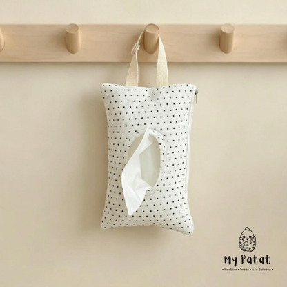 Polka dot baby wipes pouch hanging on peg rail
