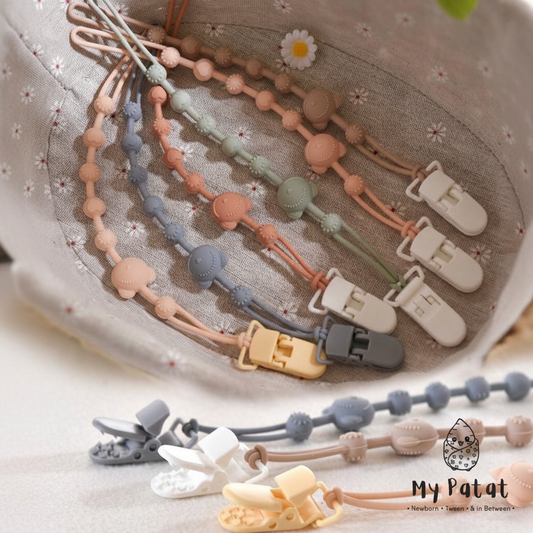 Silicone beaded dummy clip chains in pastel colours in a woven basket