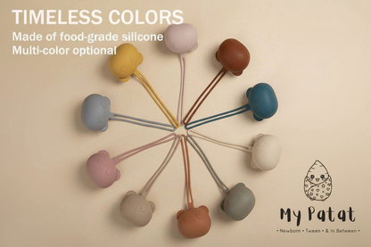 10 silicone bear soother holders in multiple pastel colours arranged in a circle