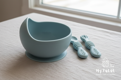 Dusty blue silicone baby bowl and spoons side lifestyle shot